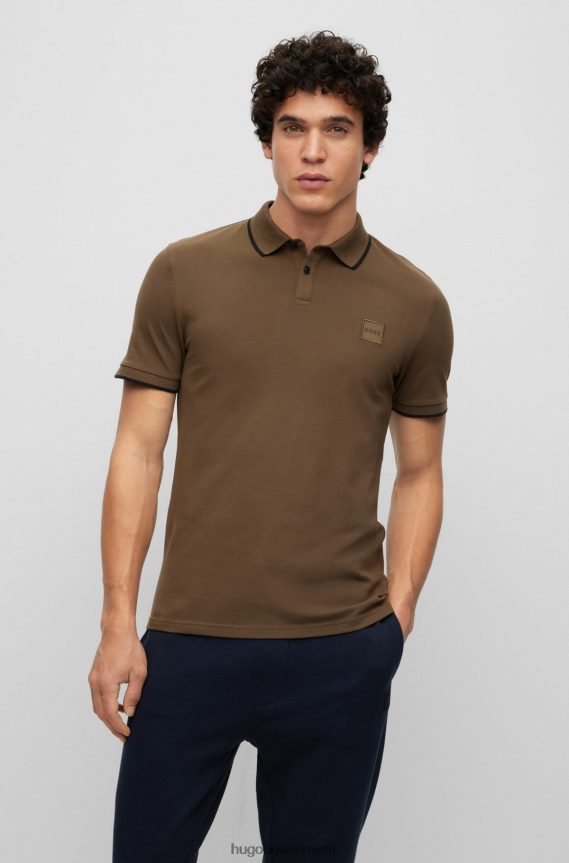 4TFNJN2881 أخضر غامق Hugo Boss قميص بولو من Hugo باللون الأخضر الداكن مصنوع من القطن المطاطي بقصة ضيقة مع رقعة الشعار