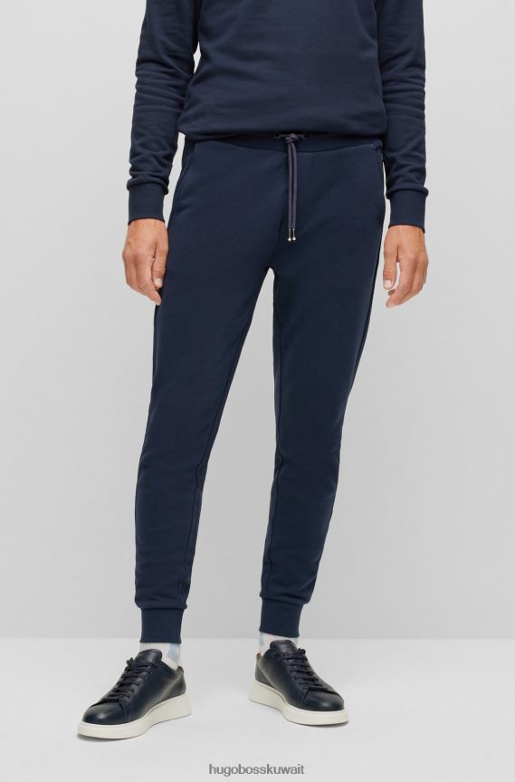 4TFNJN3032 أزرق غامق Hugo Boss بدلة رياضية من القطن العضوي باللون الأزرق الداكن مع شعار Hugo مطبوع بالمطاط