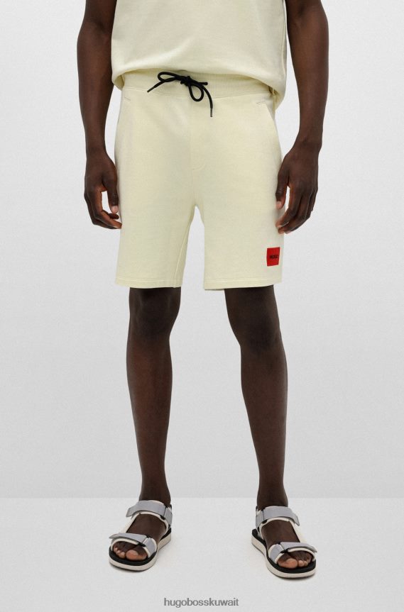 4TFNJN3495 أصفر فاتح Hugo Boss شورت من قطن تيري الفرنسي مع علامة الشعار باللون الأحمر هوغو باللون الأصفر الفاتح