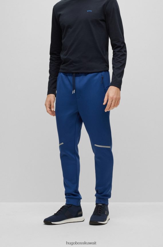 4TFNJN3537 أزرق غامق Hugo Boss قطعة سفلية رياضية من Hugo ذات قصة عادية مع تفاصيل عاكسة زخرفية باللون الأزرق الداكن