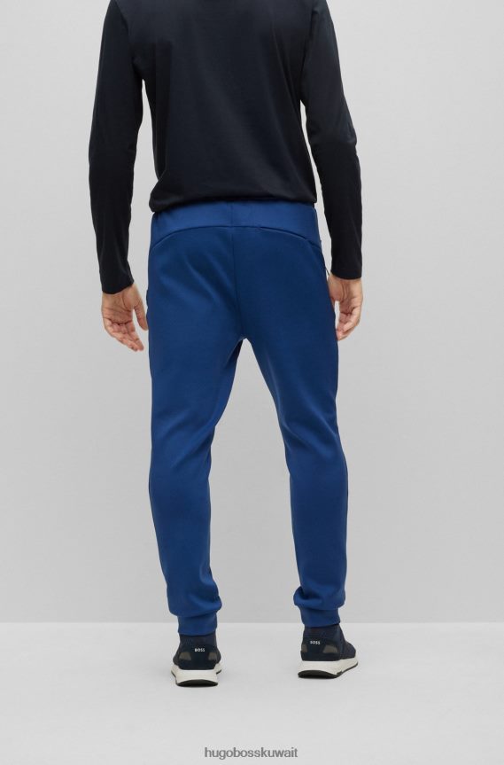 4TFNJN3537 أزرق غامق Hugo Boss قطعة سفلية رياضية من Hugo ذات قصة عادية مع تفاصيل عاكسة زخرفية باللون الأزرق الداكن