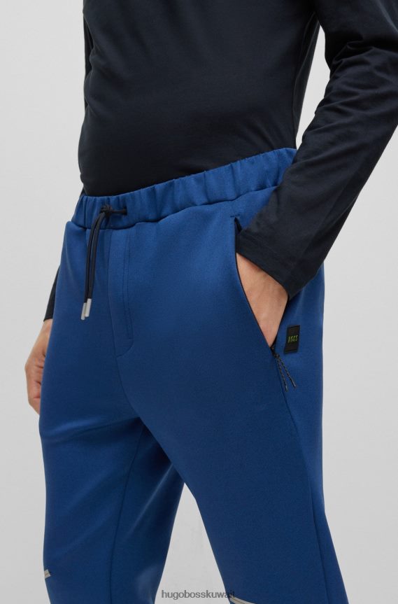 4TFNJN3537 أزرق غامق Hugo Boss قطعة سفلية رياضية من Hugo ذات قصة عادية مع تفاصيل عاكسة زخرفية باللون الأزرق الداكن