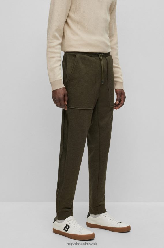 4TFNJN3554 أخضر غامق Hugo Boss بدلة رياضية من القطن المرسيري باللون الأخضر الداكن من Hugo مع شعار مطبوع بالمطاط