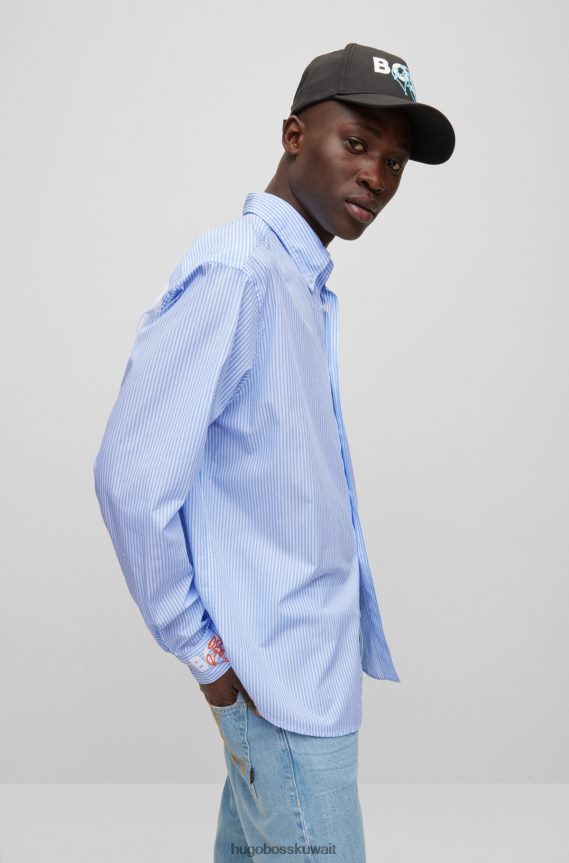 4TFNJN3578 أزرق فاتح Hugo Boss قميص أزرق فاتح بأكمام طويلة وقصة مريحة مع أعمال فنية جرافيتي هوغو