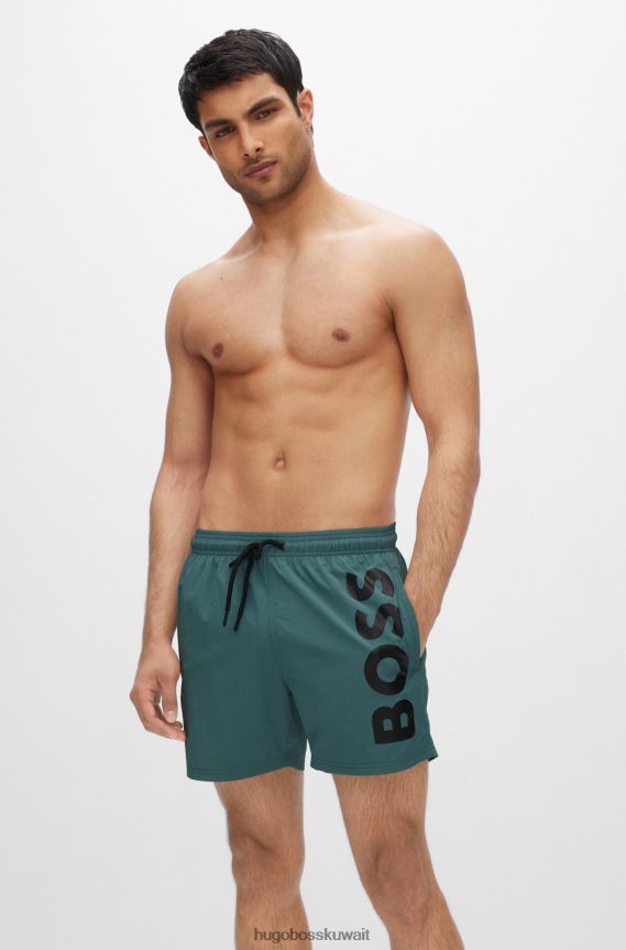 4TFNJN3821 اخضر فاتح Hugo Boss شورت سباحة سريع الجفاف باللون الأخضر الفاتح مع شعار Hugo كبير متباين