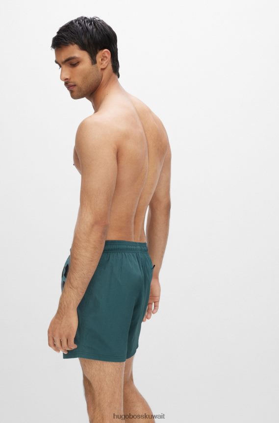 4TFNJN3821 اخضر فاتح Hugo Boss شورت سباحة سريع الجفاف باللون الأخضر الفاتح مع شعار Hugo كبير متباين