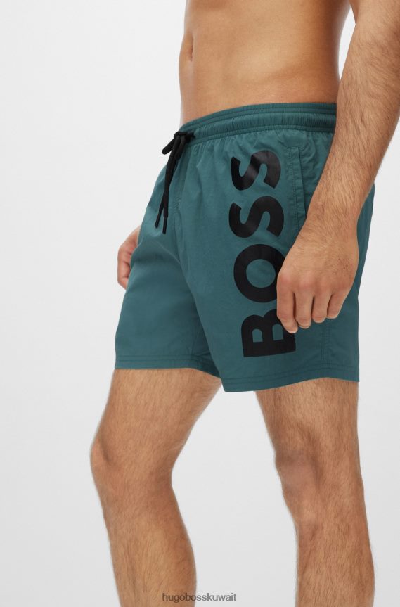 4TFNJN3821 اخضر فاتح Hugo Boss شورت سباحة سريع الجفاف باللون الأخضر الفاتح مع شعار Hugo كبير متباين