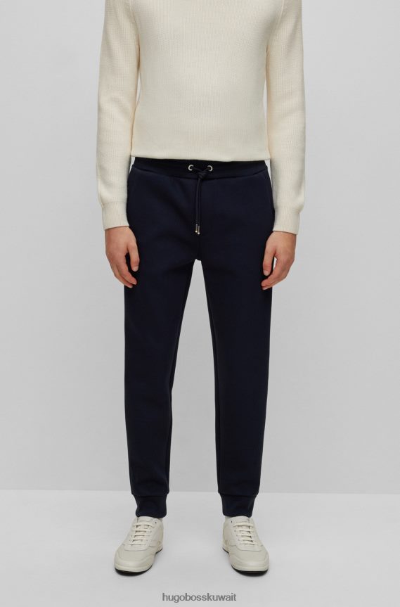 4TFNJN3950 أزرق غامق Hugo Boss قيعان رياضية بأساور من مزيج القطن مع حرير هوغو باللون الأزرق الداكن