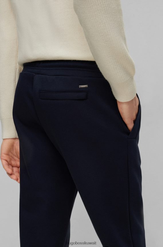 4TFNJN3950 أزرق غامق Hugo Boss قيعان رياضية بأساور من مزيج القطن مع حرير هوغو باللون الأزرق الداكن