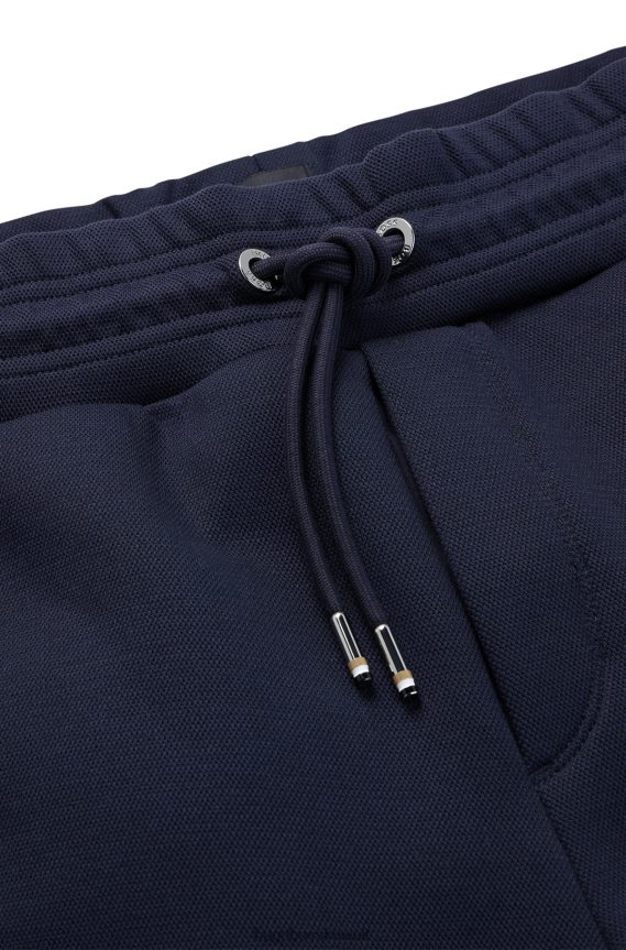 4TFNJN3950 أزرق غامق Hugo Boss قيعان رياضية بأساور من مزيج القطن مع حرير هوغو باللون الأزرق الداكن