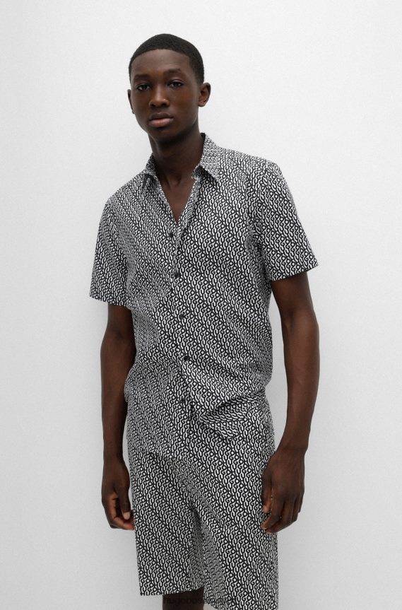 4TFNJN4096 أزرق غامق Hugo Boss قميص Hugo باللون الأزرق الداكن المريح مصنوع من القطن بطبعة الشعار وملمس الورق