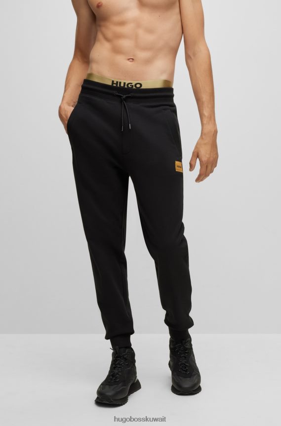 4TFNJN4109 أسود Hugo Boss سروال رياضي من Hugo مصنوع من قطن تيري مع شعار مطبوع باللون الأسود