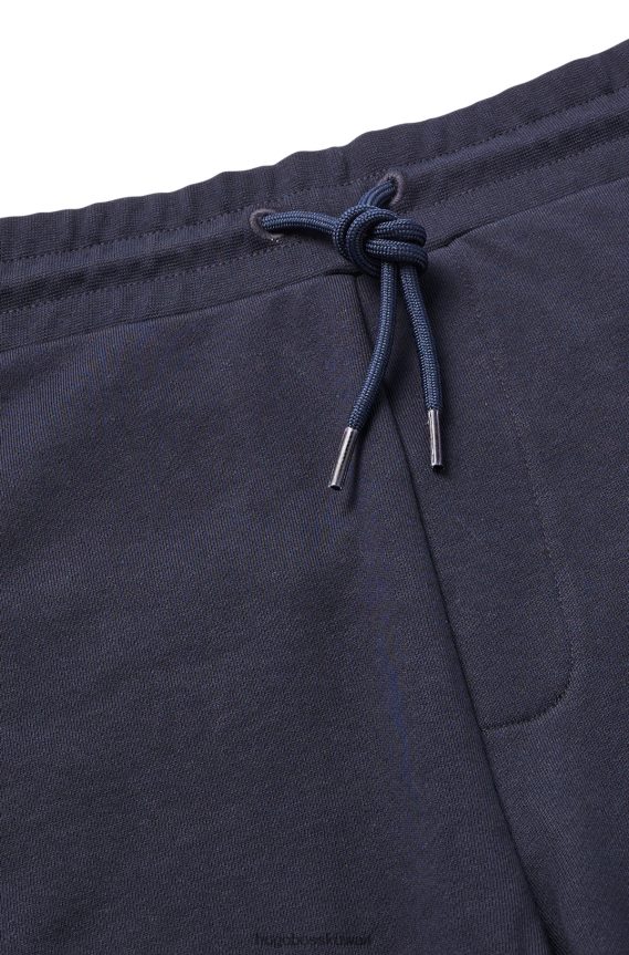 4TFNJN4134 أزرق غامق Hugo Boss شورت من قطن تيري مع تفاصيل الشعار باللون الأزرق الداكن