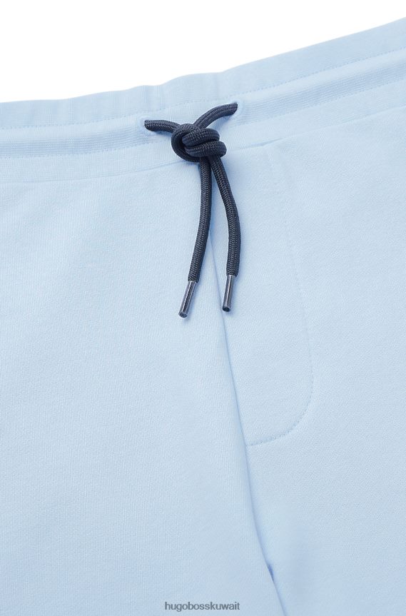 4TFNJN4135 أزرق فاتح Hugo Boss شورت من قطن تيري باللون الأزرق الفاتح مع تفاصيل شعار هوغو