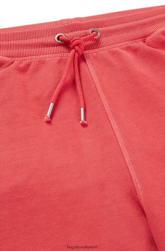 4TFNJN4189 أحمر Hugo Boss شورت من قطن تيري المصبوغ مع جيوب هوغو باللون الأحمر