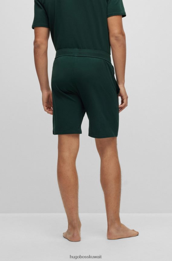4TFNJN4198 أخضر غامق Hugo Boss شورت بيجامة من القطن المطاطي باللون الأخضر الداكن مع شعار هوغو مخطط تفصيلي