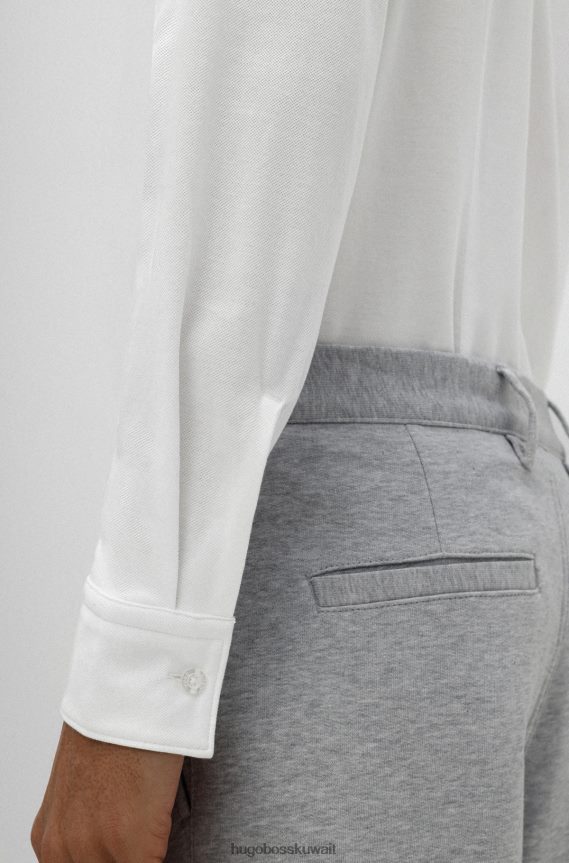 4TFNJN4239 أبيض Hugo Boss قميص بقصّة ضيّقة من قطن الجيرسيه بيكيه هوغو باللون الأبيض