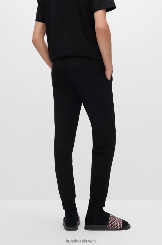 4TFNJN4299 أسود Hugo Boss بنطلون بيجامة من القطن المطاطي باللون الأسود من Hugo مع حزام خصر يحمل الشعار