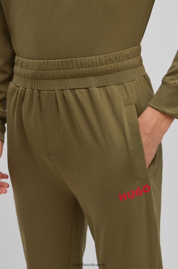 4TFNJN4402 اخضر فاتح Hugo Boss قطعة سفلية رياضية من قطن الجيرسيه المطاطي باللون الأخضر الفاتح مع شعار Hugo باللون الأحمر