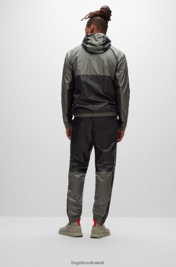 4TFNJN4471 الرمادي الداكن Hugo Boss بدلة رياضية Hugo مقاومة للماء مع تفاصيل الشعار باللون الرمادي الداكن