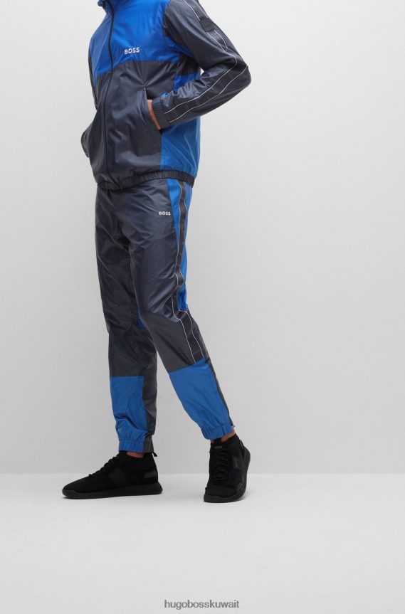 4TFNJN4472 أزرق غامق Hugo Boss بدلة رياضية مقاومة للماء مع تفاصيل الشعار باللون الأزرق الداكن