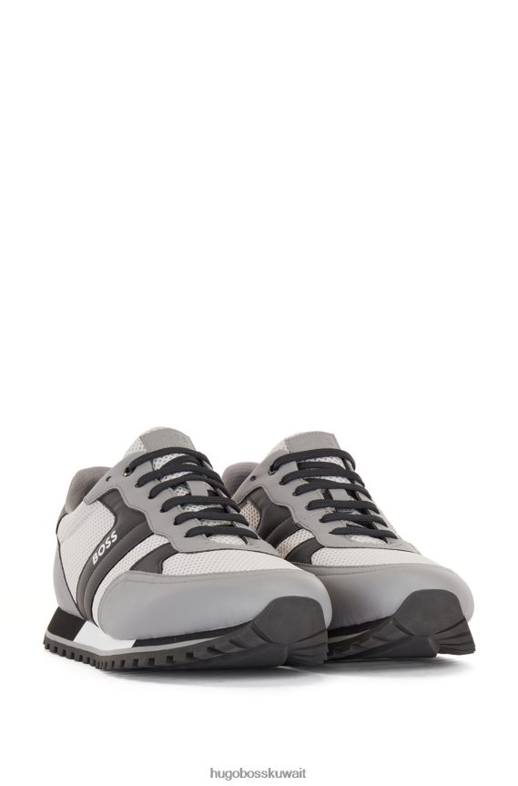 4TFNJN4768 رمادي فاتح Hugo Boss حذاء رياضي باللون الرمادي الفاتح مزين بشعار شبكي مع لمسات مطاطية من هوغو