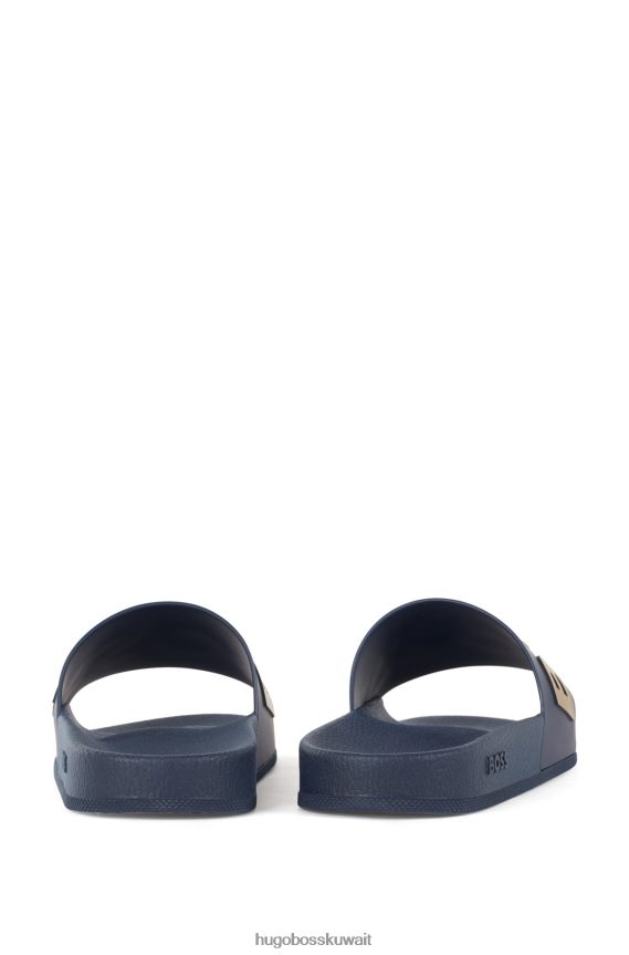 4TFNJN4802 أزرق غامق Hugo Boss شرائح هوغو إيطالية الصنع باللون الأزرق الداكن مع حزام يحمل شعارًا متباينًا