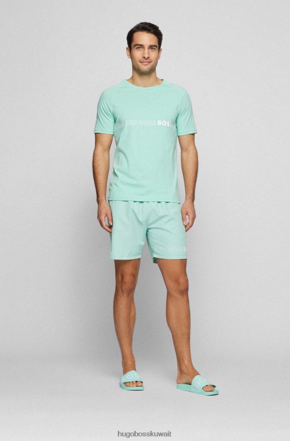 4TFNJN4803 اخضر فاتح Hugo Boss شبشب هوغو إيطالي الصنع باللون الأخضر الفاتح مع حزام يحمل شعارًا متباينًا