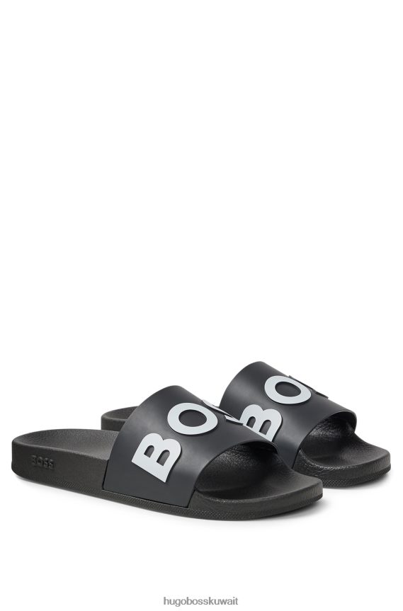 4TFNJN4806 أسود Hugo Boss شرائح سوداء إيطالية الصنع مع حزام هوغو يحمل شعارًا متباينًا