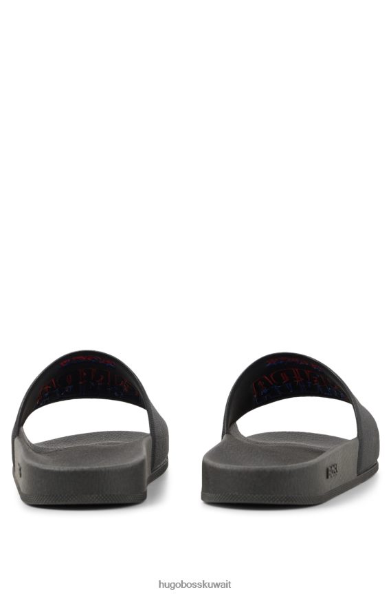 4TFNJN4986 أسود Hugo Boss شرائح سوداء إيطالية الصنع تحمل العلامة التجارية التعاونية Hugo