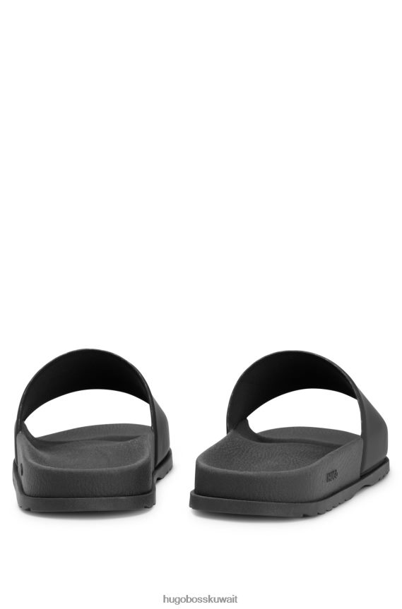 4TFNJN5041 أسود Hugo Boss شرائح PVC مع Jaglion وشعار Hugo الأسود المطبوع