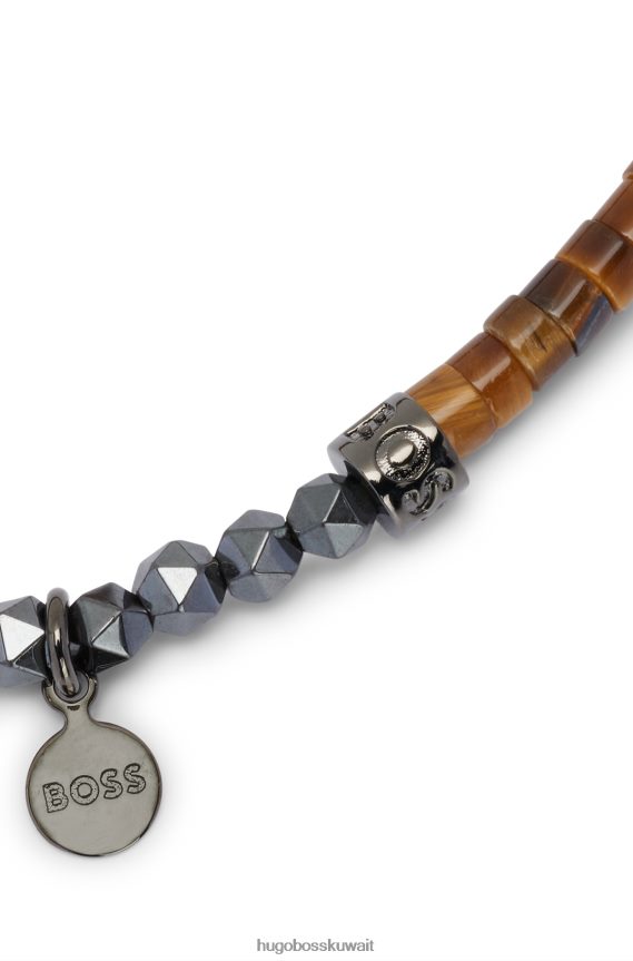 4TFNJN5251 بني Hugo Boss سوار من الهيماتيت البني وعين النمر مزين بتفاصيل الشعار