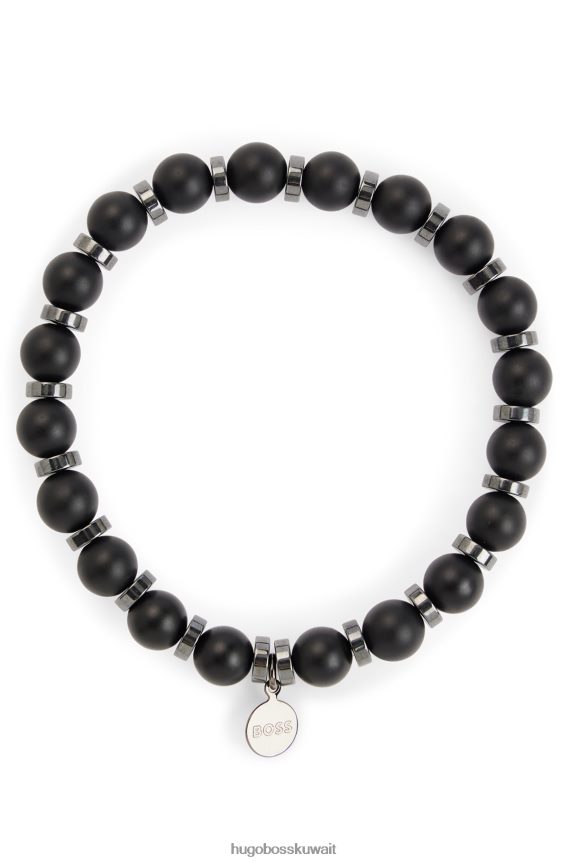 4TFNJN5431 أسود Hugo Boss سوار Hugo باللون الأسود غير اللامع من العقيق والهيماتيت مع علامة شعار معدنية