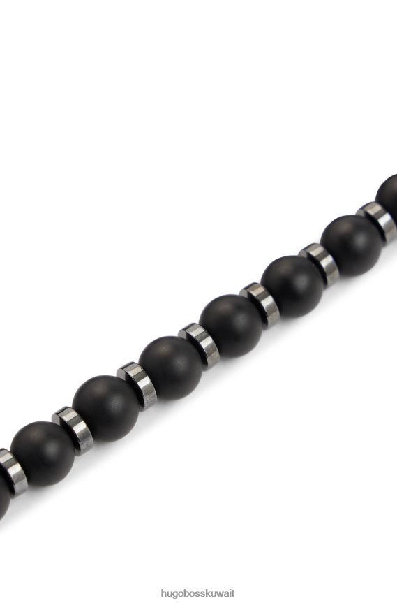 4TFNJN5431 أسود Hugo Boss سوار Hugo باللون الأسود غير اللامع من العقيق والهيماتيت مع علامة شعار معدنية