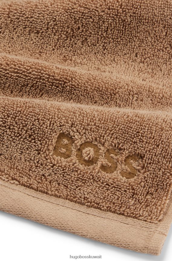 4TFNJN5522 بني Hugo Boss قطعة قماش للوجه تحمل العلامة التجارية Hugo باللون البني مصنوعة من قطن بحر إيجه الممشط