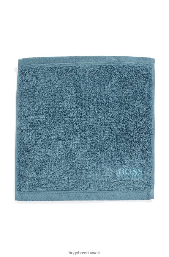4TFNJN5523 أزرق Hugo Boss قطعة قماش للوجه تحمل العلامة التجارية Hugo مصنوعة من قطن بحر إيجه الممشط باللون الأزرق