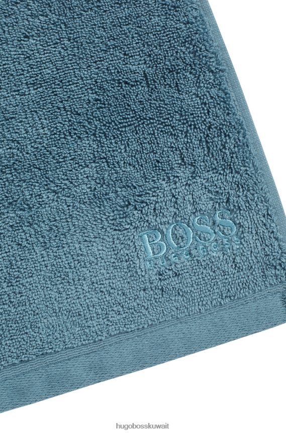4TFNJN5523 أزرق Hugo Boss قطعة قماش للوجه تحمل العلامة التجارية Hugo مصنوعة من قطن بحر إيجه الممشط باللون الأزرق