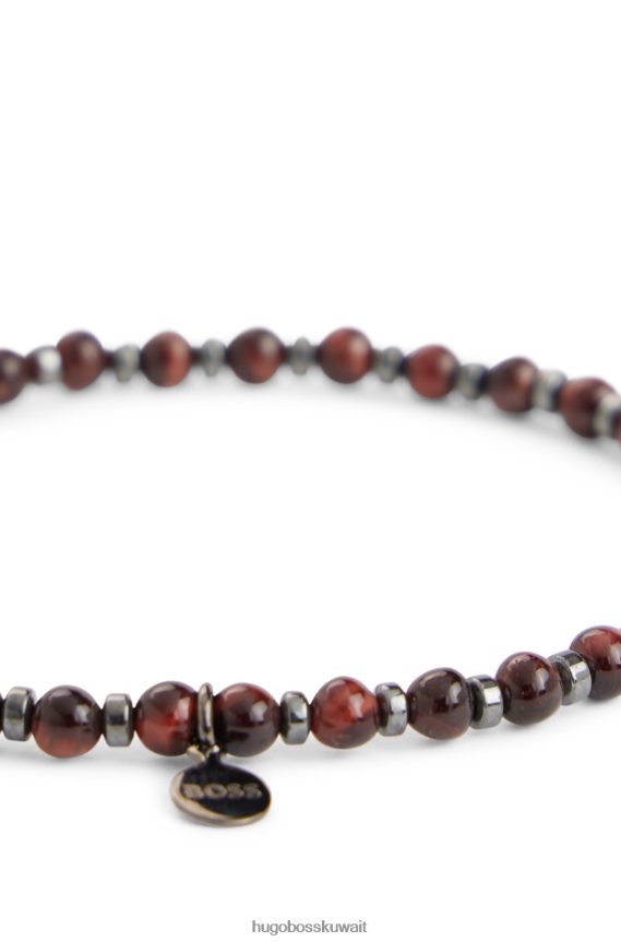4TFNJN5583 بني Hugo Boss سوار عين النمر البني والهيماتيت مع علامة معدنية تحمل علامة هوغو