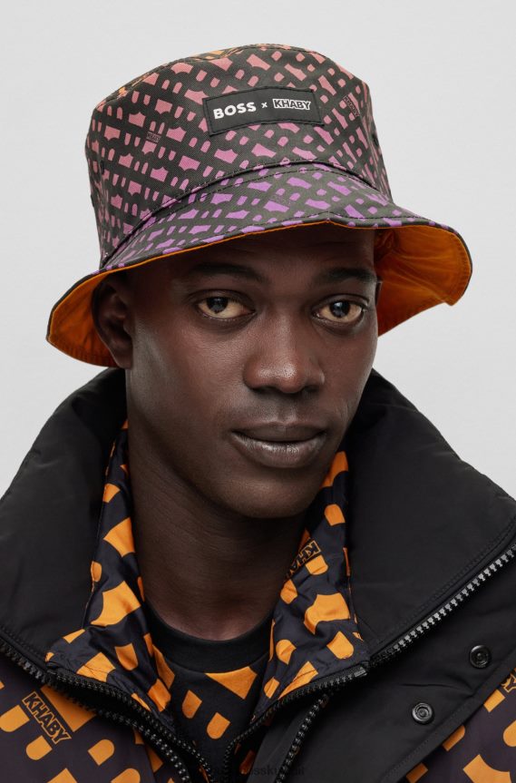 4TFNJN5595 برتقالي فاتح Hugo Boss قبعة دلو ذات وجهين × خابي مع حروف مونوغرامية على كامل التصميم