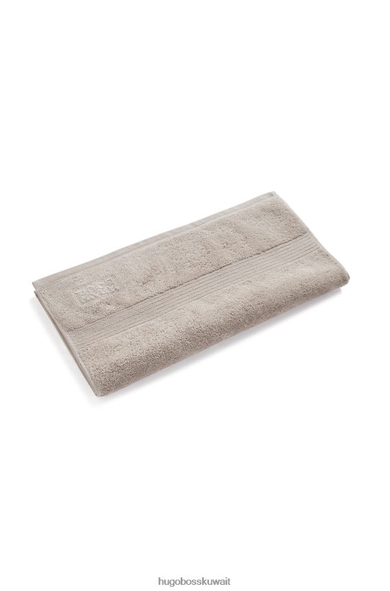 4TFNJN5609 البيج الفاتح Hugo Boss منشفة يد بشعار من قطن بحر إيجه باللون البيج الفاتح