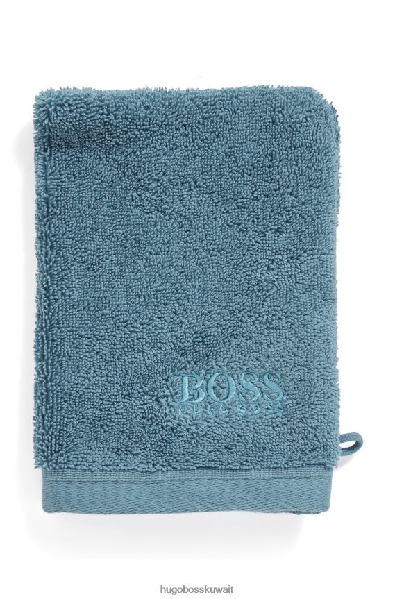 4TFNJN5725 أزرق غامق Hugo Boss قفاز غسيل بشعار باللون الأزرق الداكن مصنوع من قطن هوغو بحر إيجه