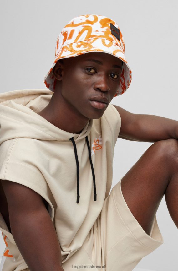 4TFNJN5755 البرتقالي Hugo Boss قبعة دلو باللون البرتقالي من Hugo Graffiti Artwork مصنوعة من نسيج قطني مضلع