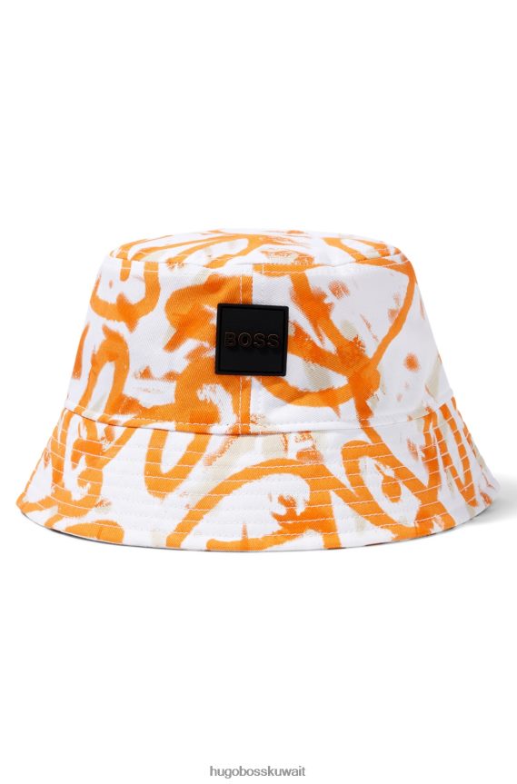 4TFNJN5755 البرتقالي Hugo Boss قبعة دلو باللون البرتقالي من Hugo Graffiti Artwork مصنوعة من نسيج قطني مضلع