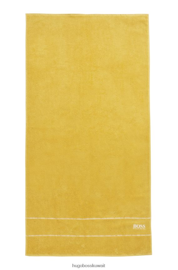 4TFNJN5782 ذهب Hugo Boss منشفة حمام هوجو من القطن المصري باللون الذهبي مع شعار متباين